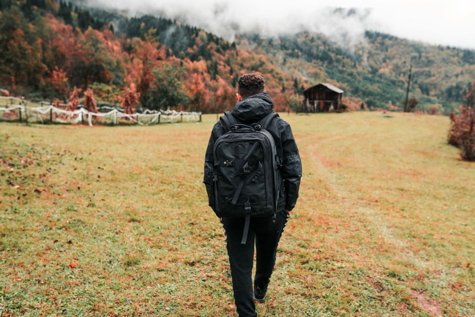 A man hiking through a beautiful autumn landscape in Artvin, Türkiye.